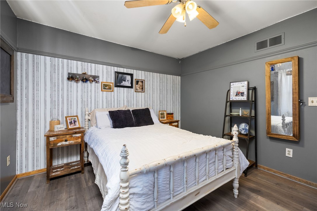 11827 Stratton Road West Salem, OH 44287 - Photo 37 of 47 Bedroom featuring dark wood finished floors and a ceiling fan