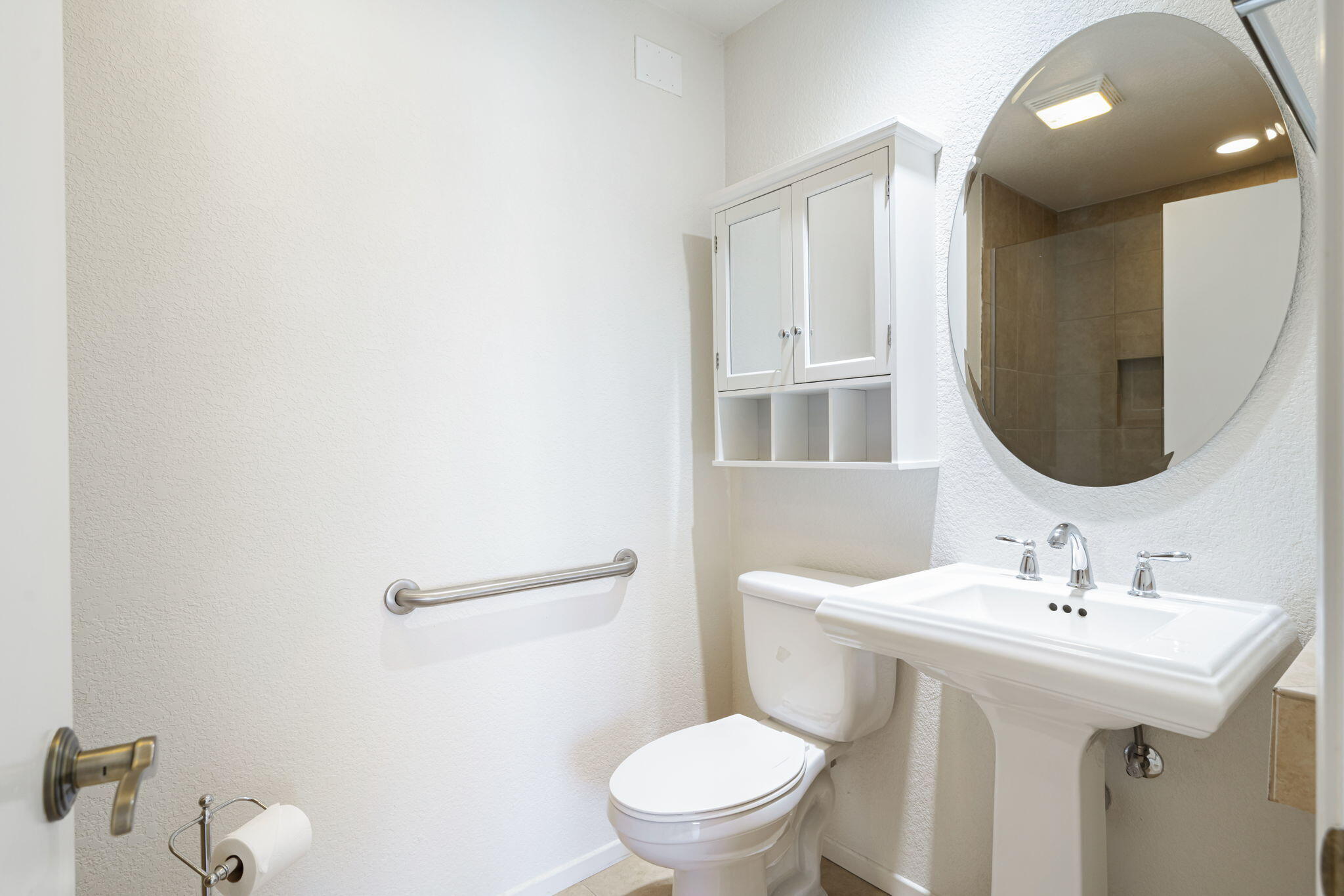 82560 Delano Drive Indio, CA 92201 - Photo 24 of 51 a bathroom with a toilet a sink and mirror