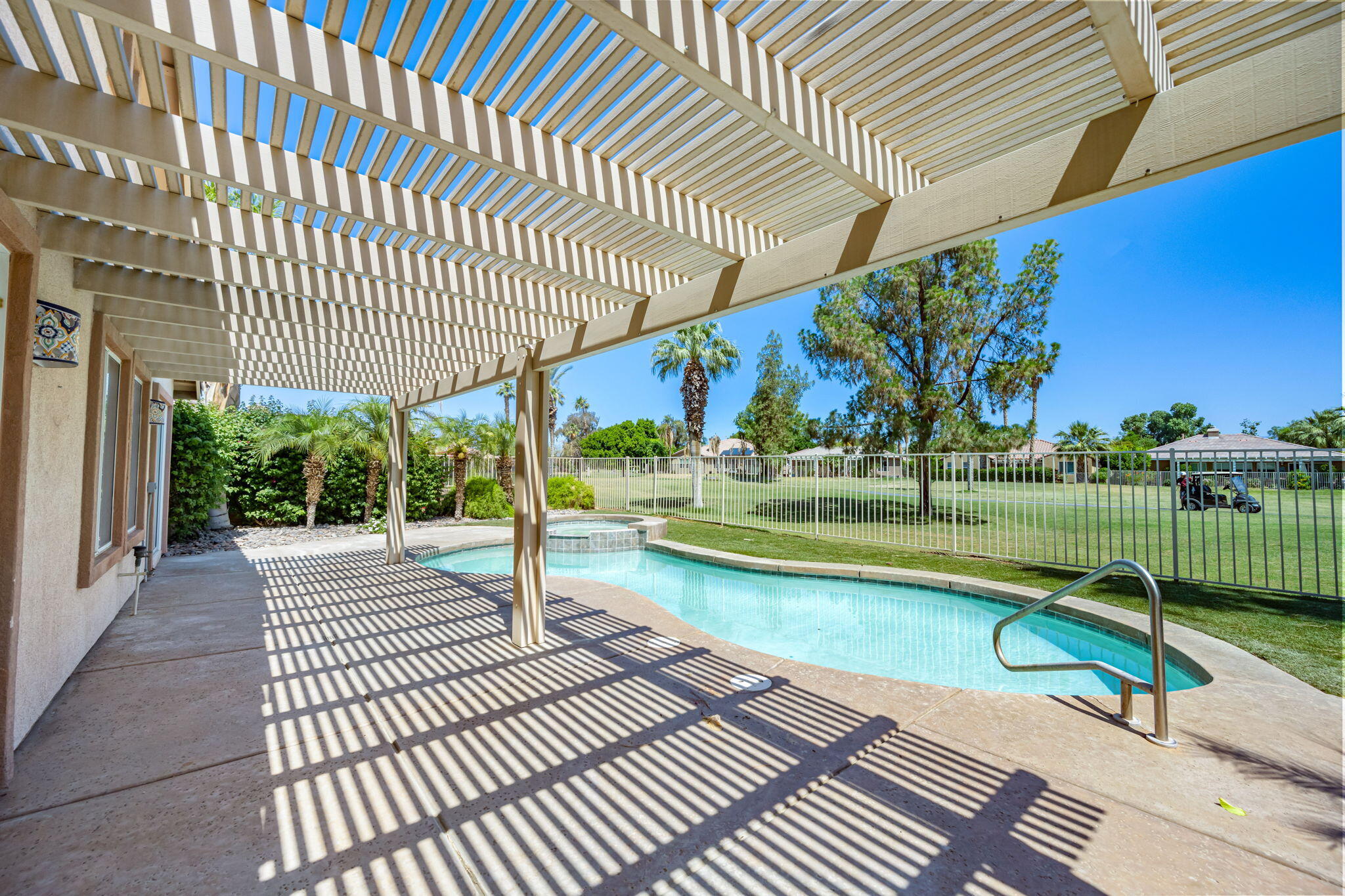 82560 Delano Drive Indio, CA 92201 - Photo 31 of 51 a view of a swimming pool with a patio