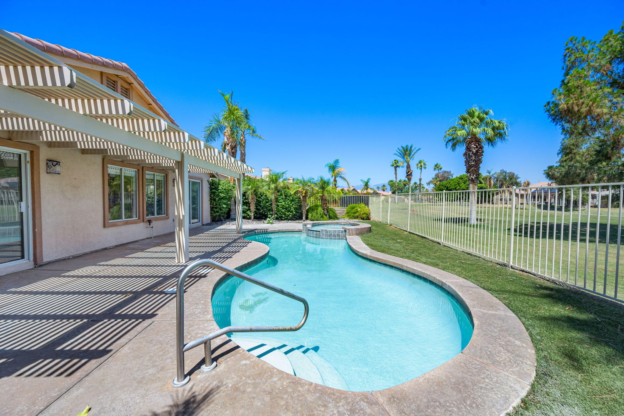 82560 Delano Drive Indio, CA 92201 - Photo 33 of 51 a view of a swimming pool with a patio