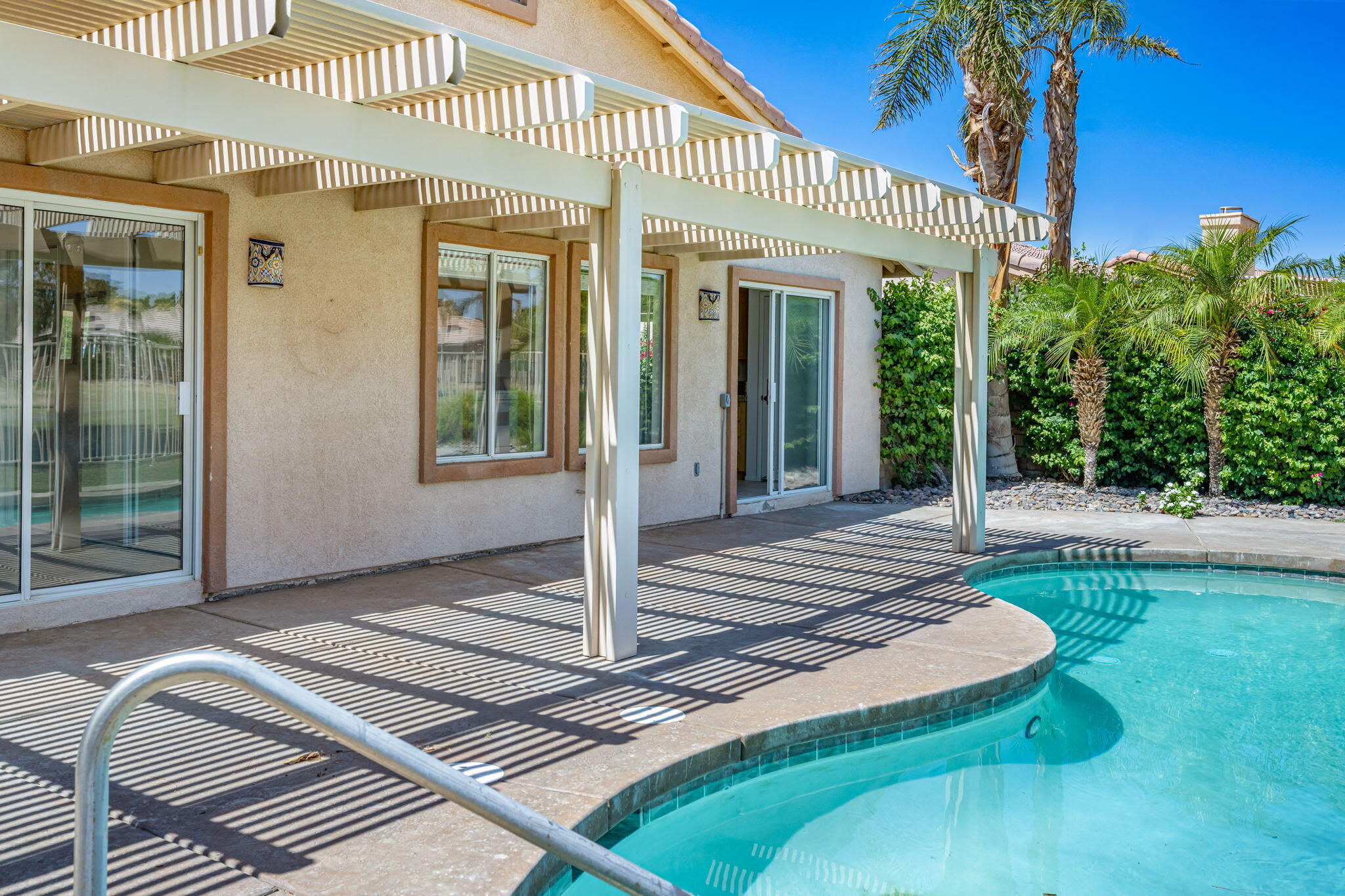 82560 Delano Drive Indio, CA 92201 - Photo 34 of 51 a front view of a house with a porch