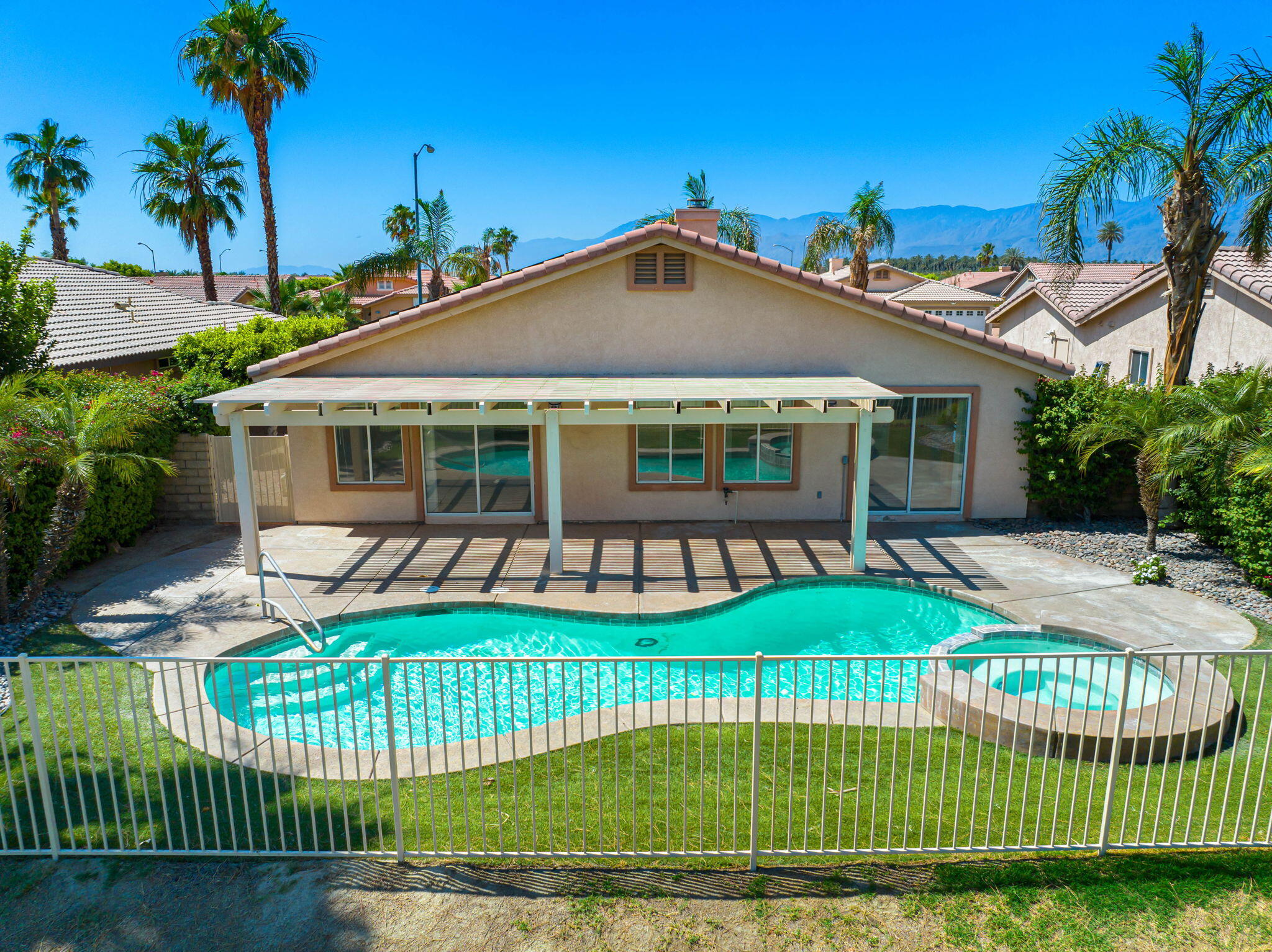 82560 Delano Drive Indio, CA 92201 - Photo 37 of 51 a view of a house with a yard and plants