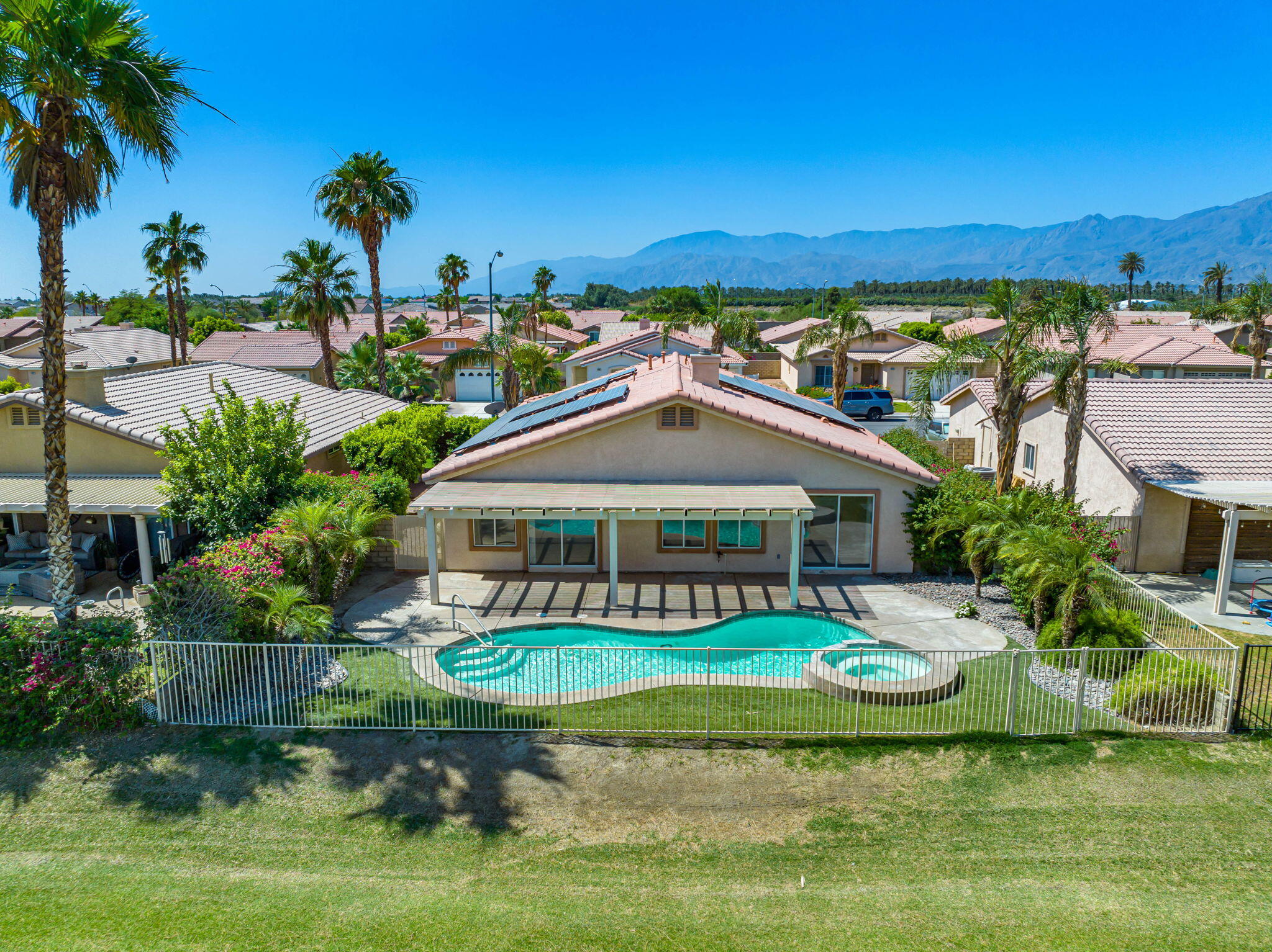 82560 Delano Drive Indio, CA 92201 - Photo 38 of 51 a front view of a house with garden