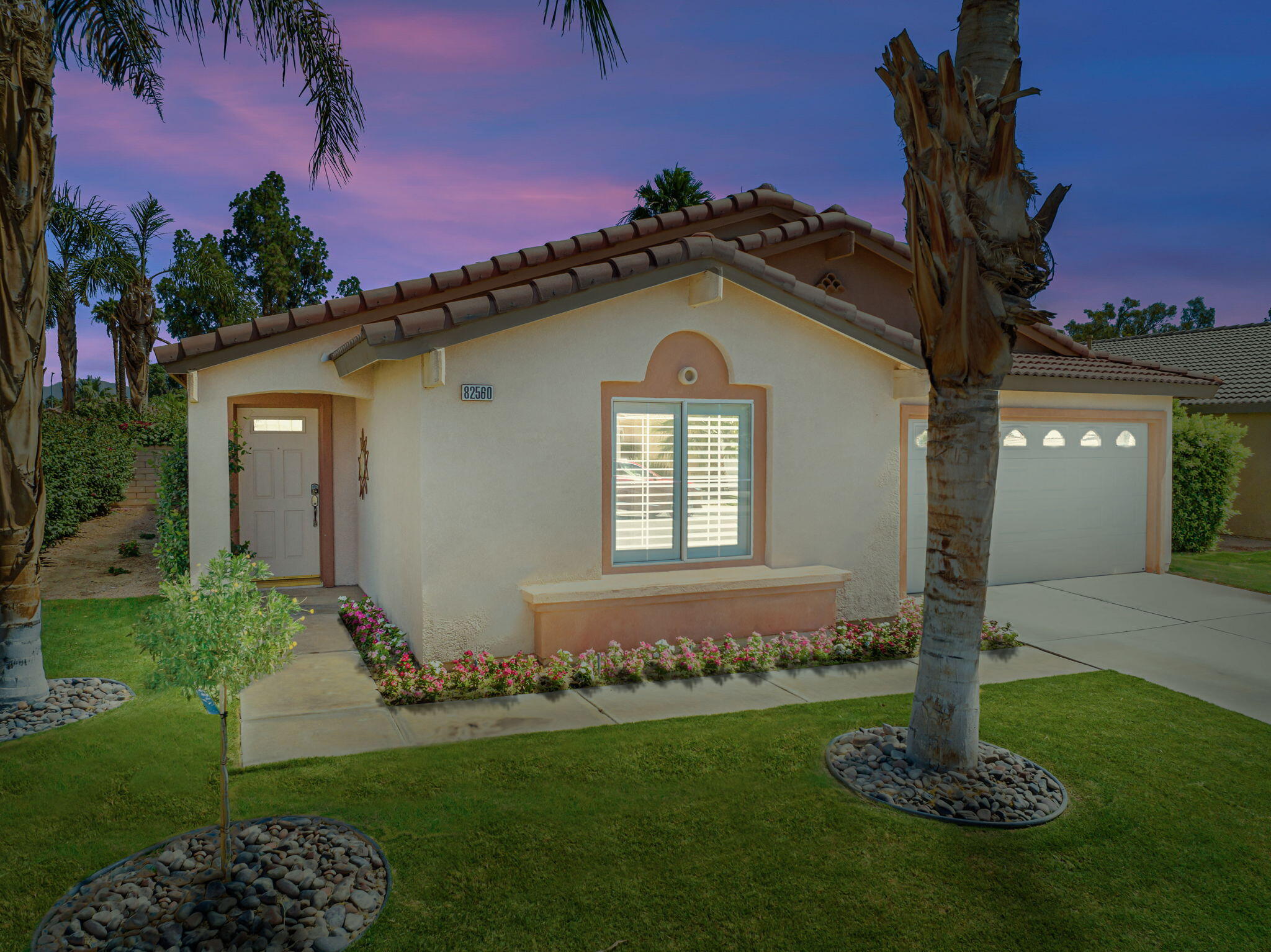82560 Delano Drive Indio, CA 92201 - Photo 40 of 51 a front view of a house with garden