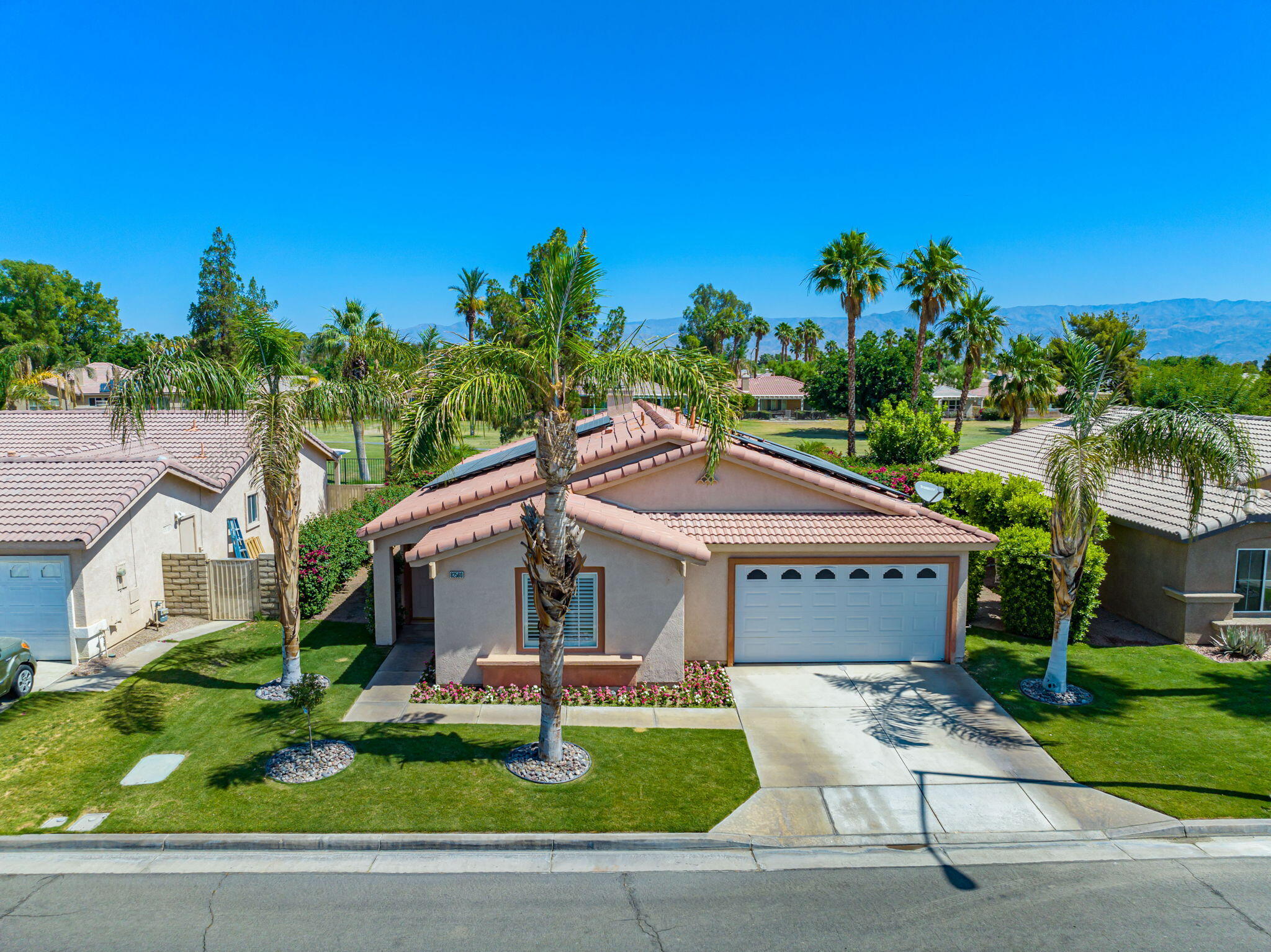 82560 Delano Drive Indio, CA 92201 - Photo 41 of 51 a front view of a house with garden