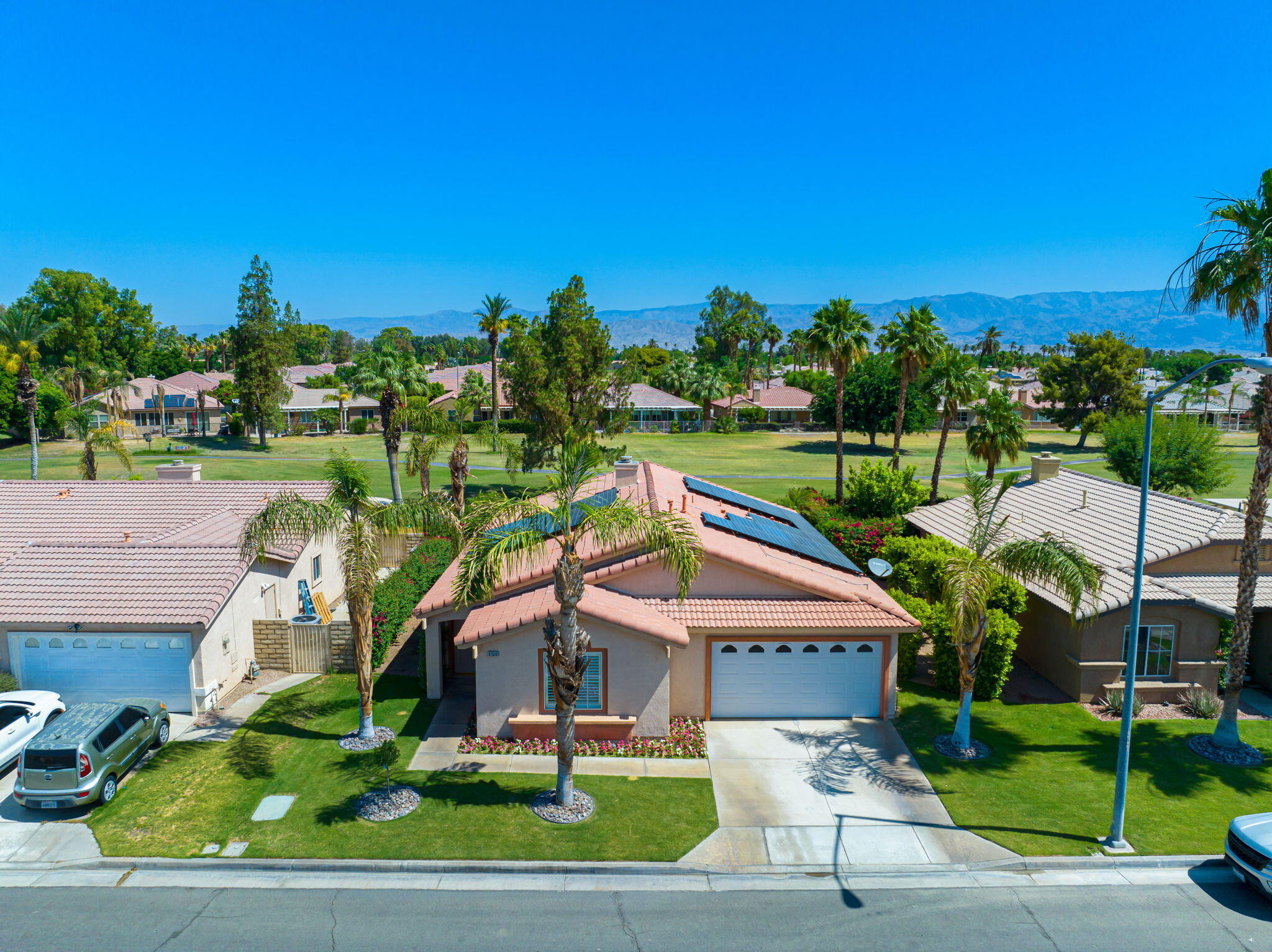 82560 Delano Drive Indio, CA 92201 - Photo 42 of 51 a aerial view of a house with a yard and potted plants