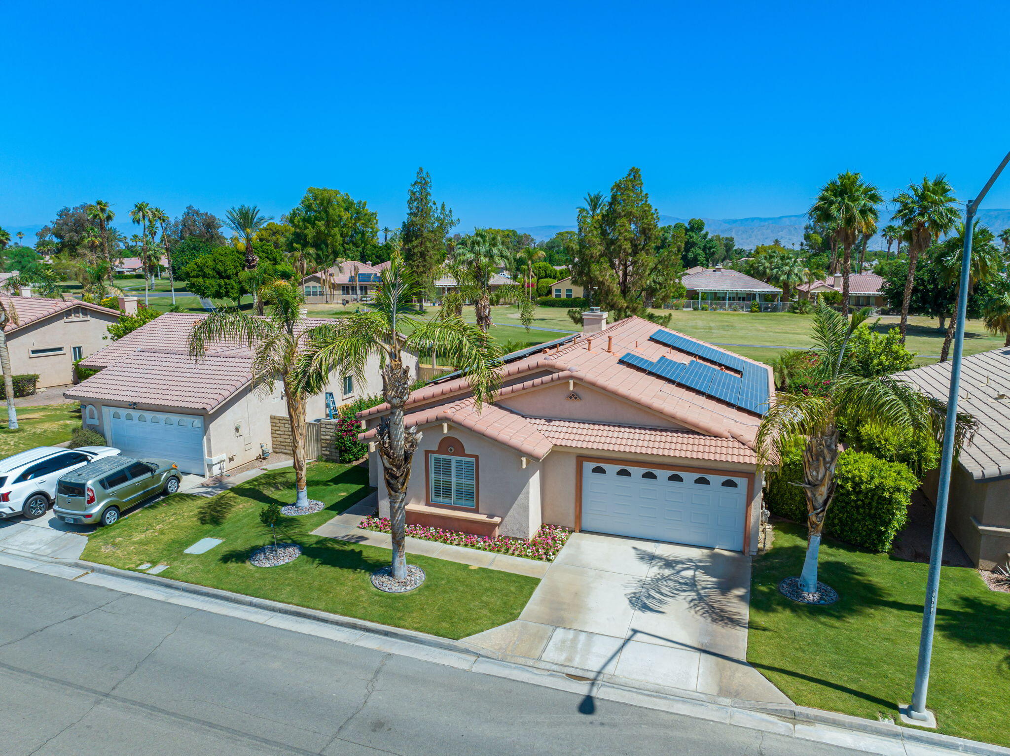 82560 Delano Drive Indio, CA 92201 - Photo 43 of 51 a aerial view of a house with a yard and potted plants