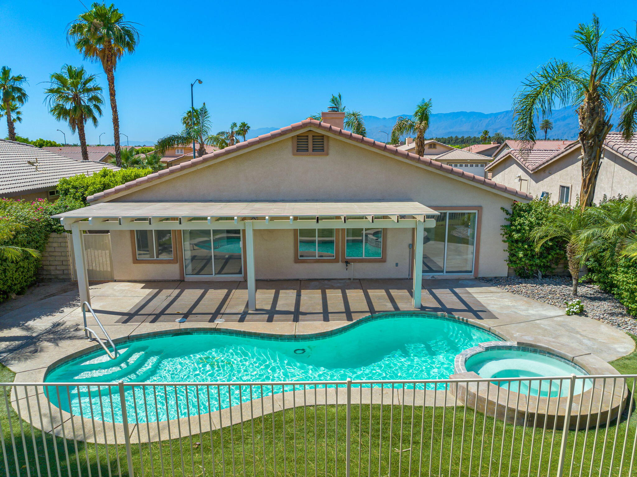 82560 Delano Drive Indio, CA 92201 - Photo 44 of 51 a front view of a house with garden