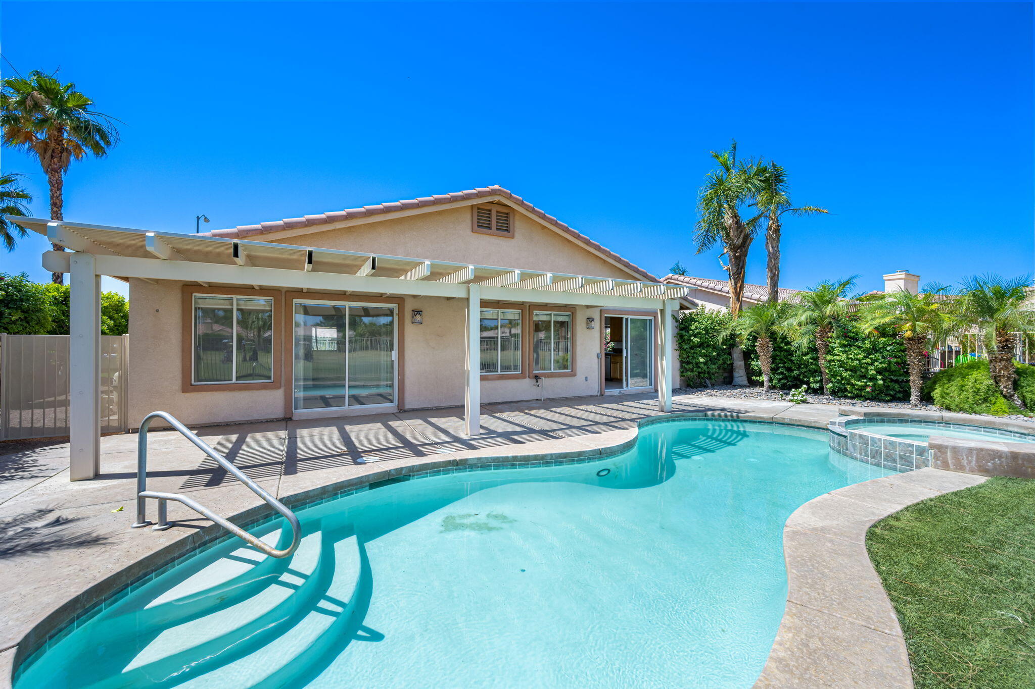 82560 Delano Drive Indio, CA 92201 - Photo 46 of 51 a view of a house with backyard sitting area and garden