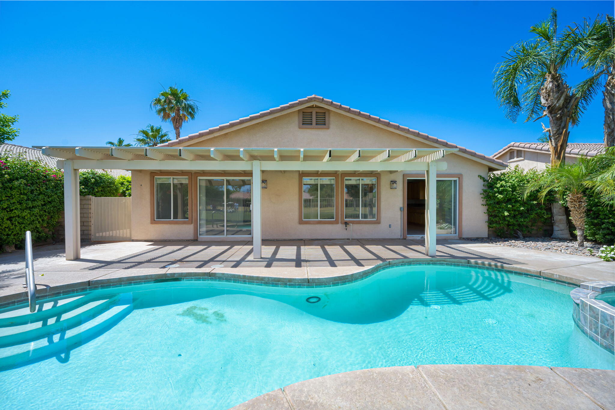 82560 Delano Drive Indio, CA 92201 - Photo 47 of 51 a view of a house with a yard patio and swimming pool