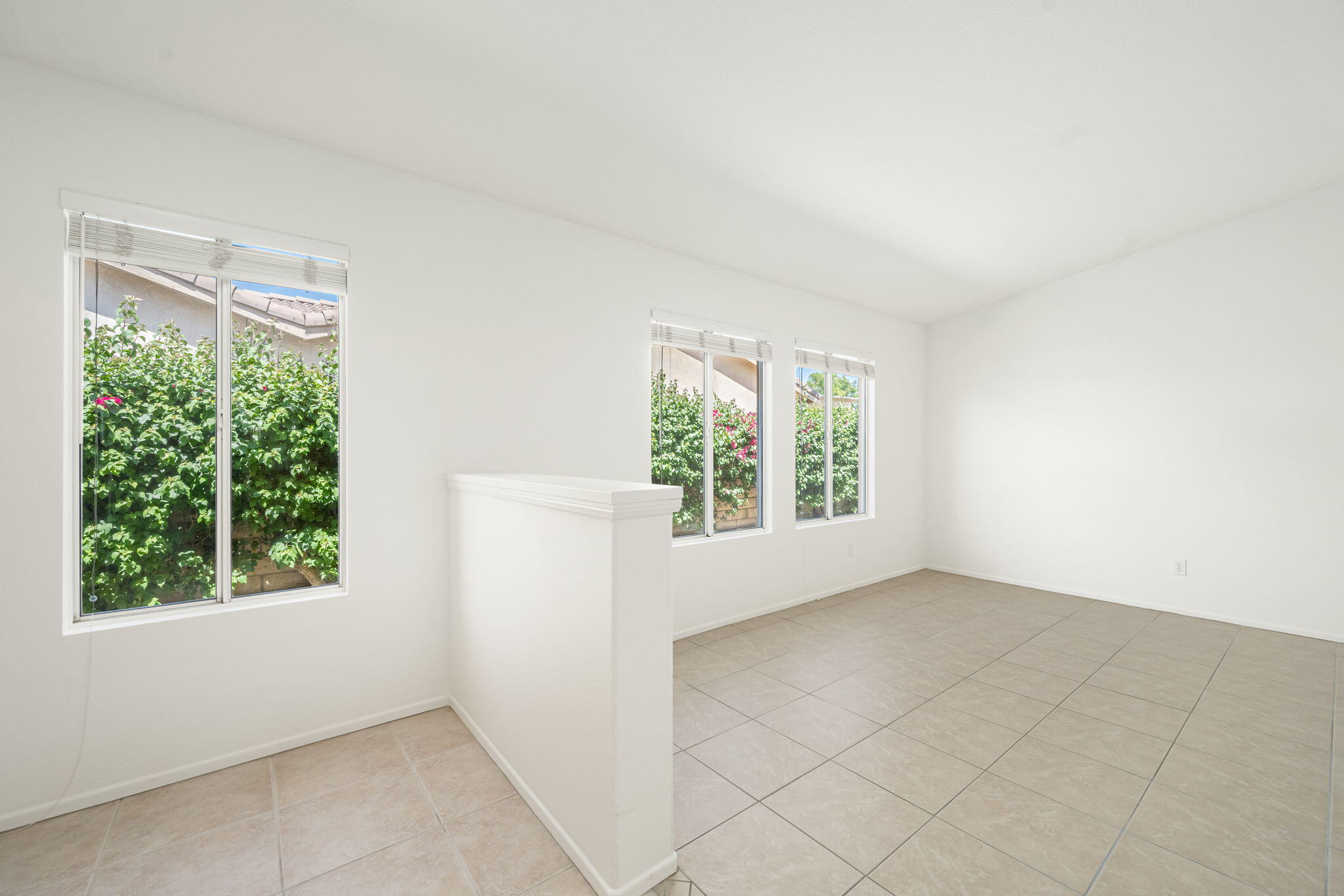 82560 Delano Drive Indio, CA 92201 - Photo 6 of 51 an empty room with windows