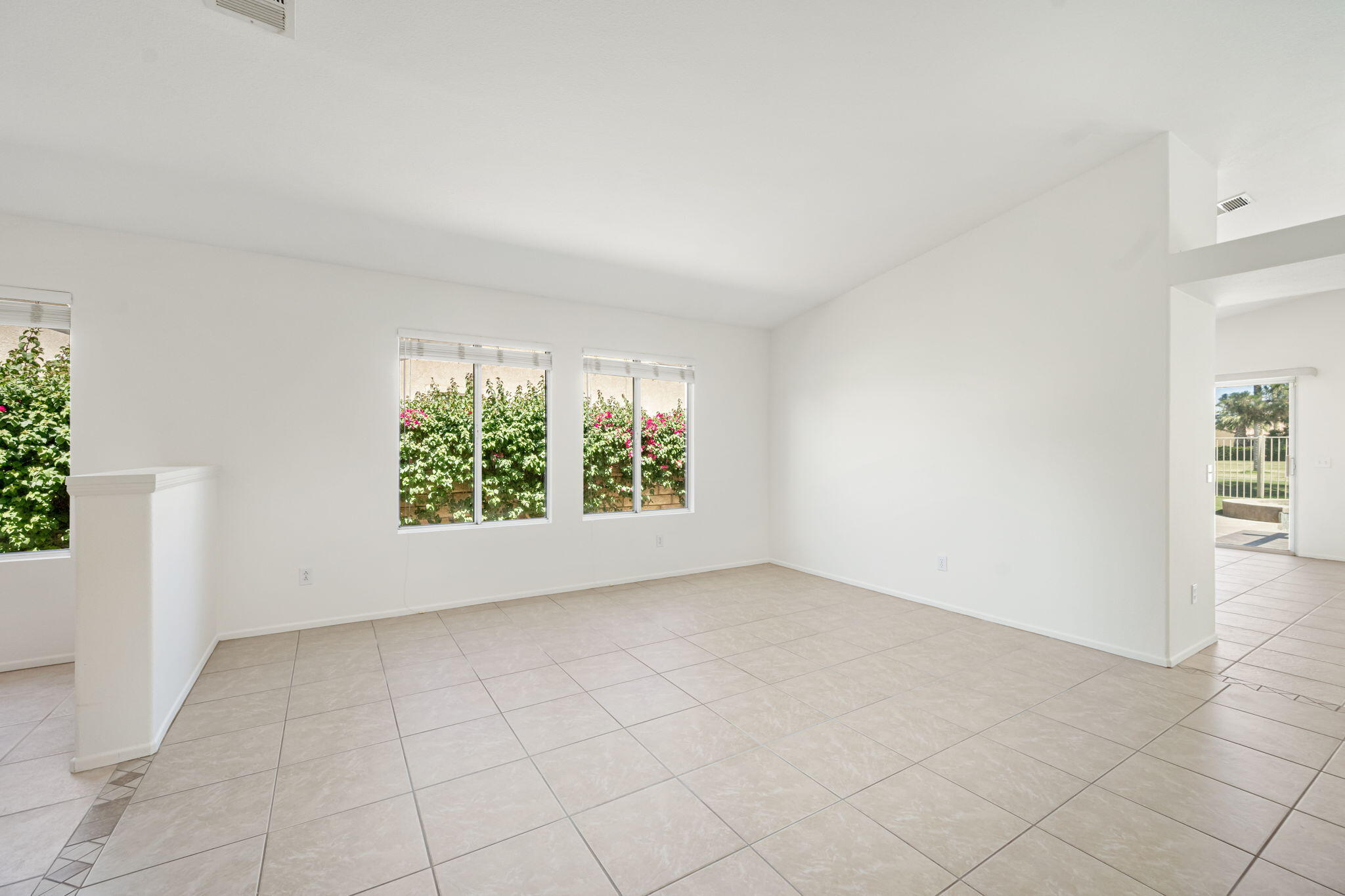 82560 Delano Drive Indio, CA 92201 - Photo 7 of 51 an empty room with windows