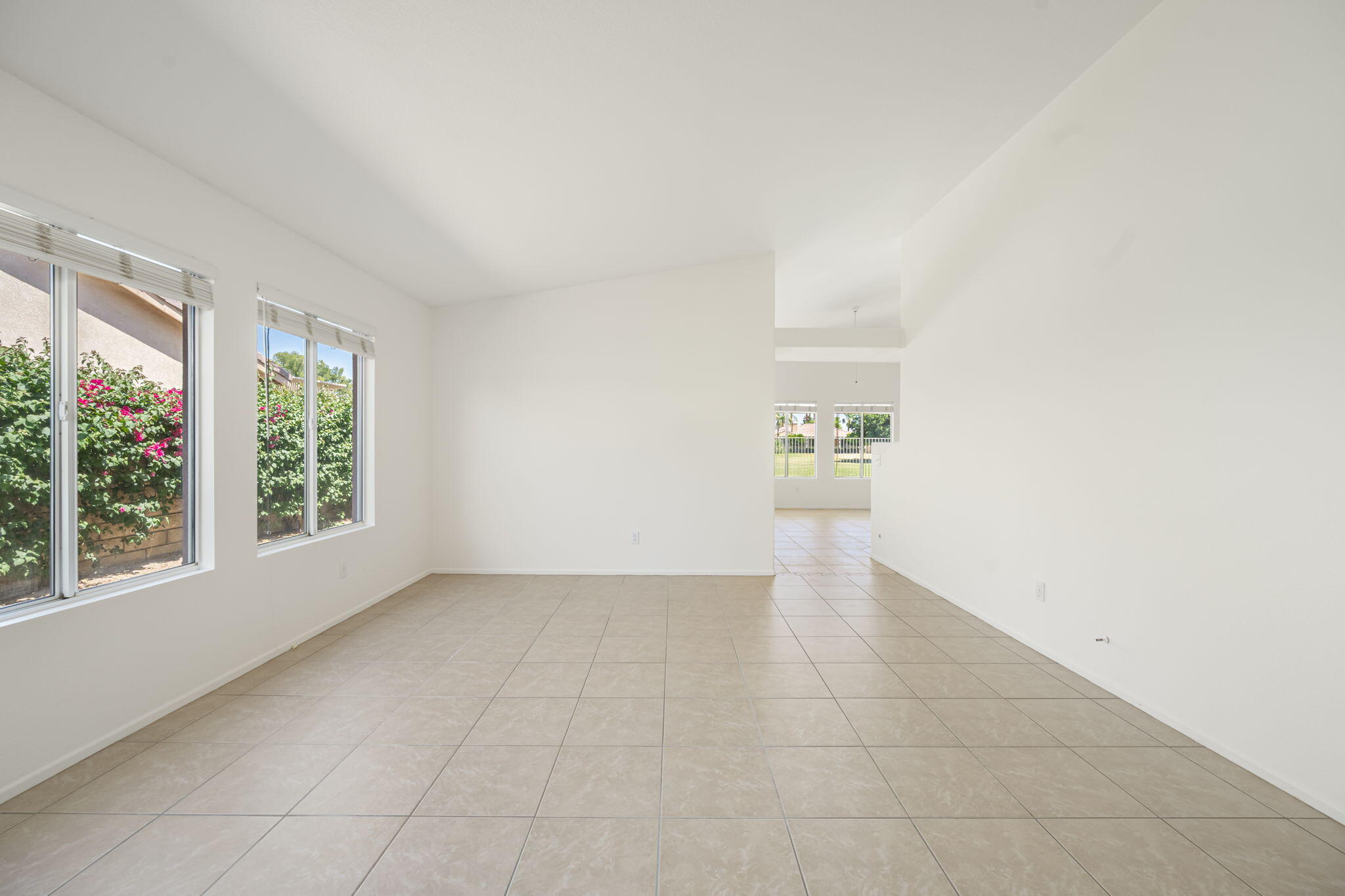 82560 Delano Drive Indio, CA 92201 - Photo 8 of 51 an empty room with windows