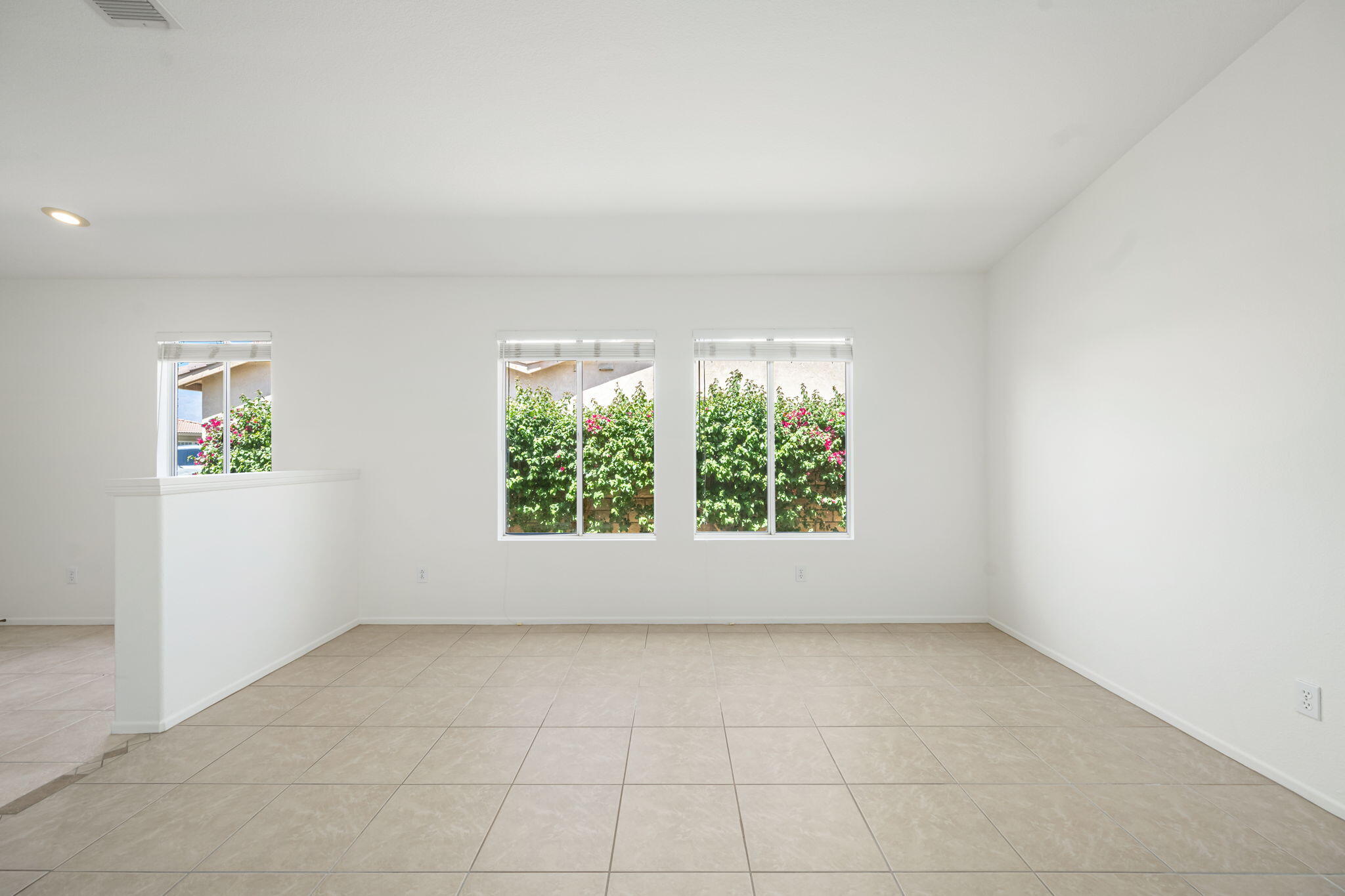 82560 Delano Drive Indio, CA 92201 - Photo 9 of 51 an empty room with a window