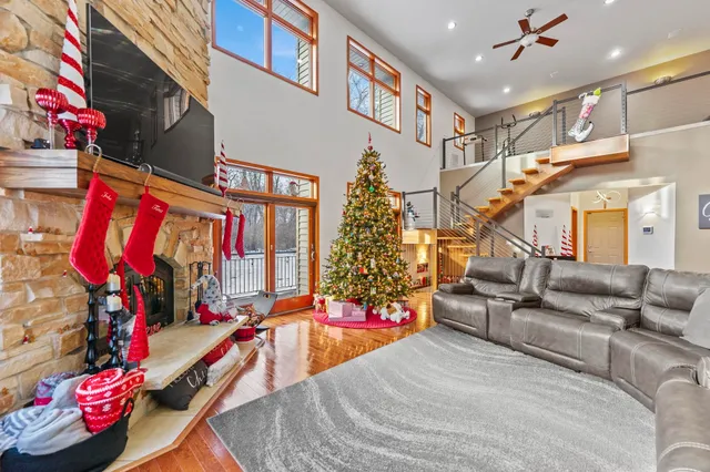 a front view of a house with a yard covered in snow