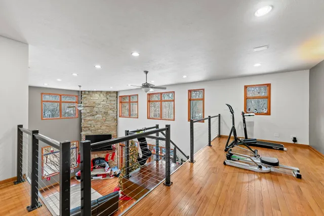 a bedroom with furniture and a flat screen tv
