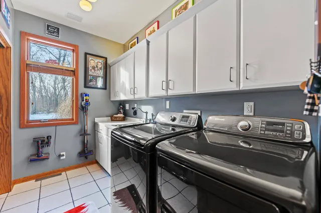 a bathroom with a sink double vanity and a mirror