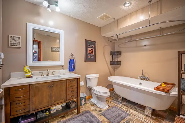 a reading room with furniture and a bookshelf