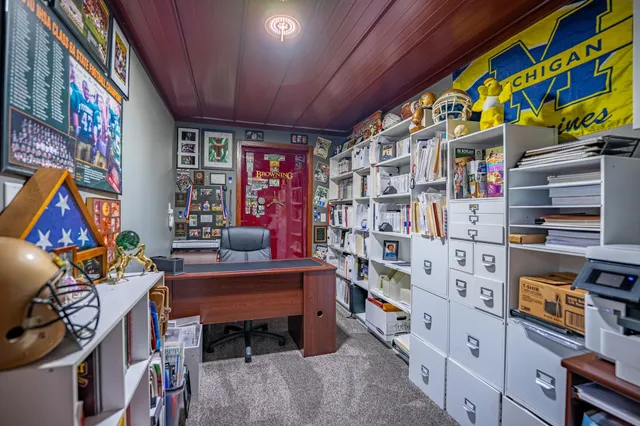 a white house with a large tree in front of it