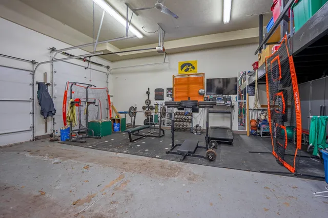 a front view of a house with a yard covered in snow