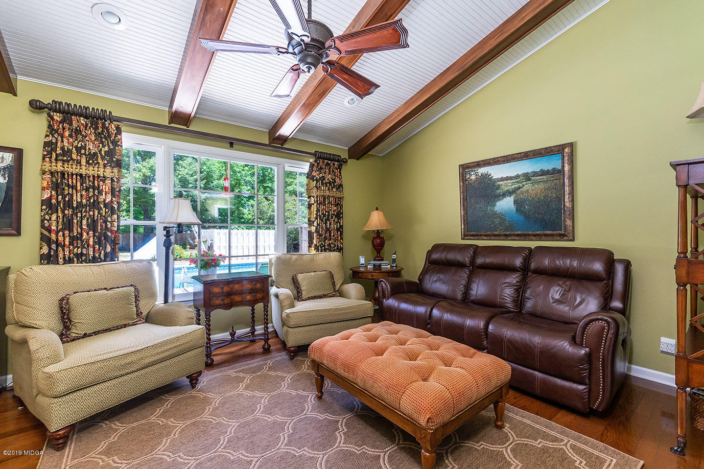 5277 Zebulon Road Macon, GA 31210 - Photo 14 of 42 a living room with furniture and a large window