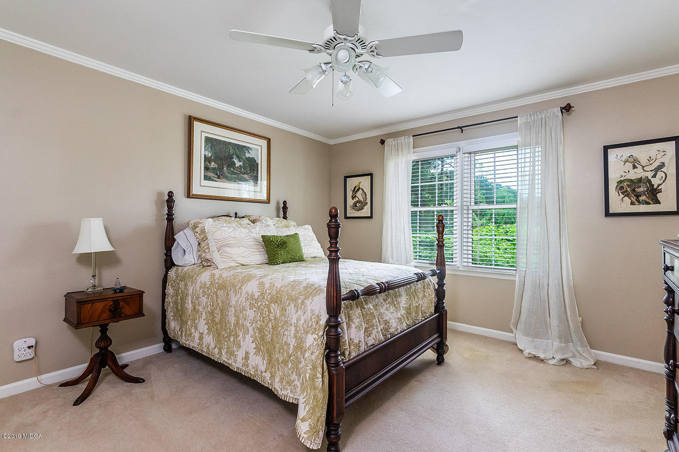 5277 Zebulon Road Macon, GA 31210 - Photo 22 of 42 a bed room with a bed and a window