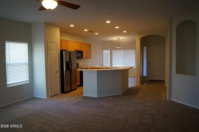 a view of a kitchen outdoor kitchen and stainless steel appliances