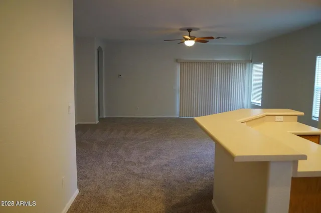 a view of a livingroom with a kitchen