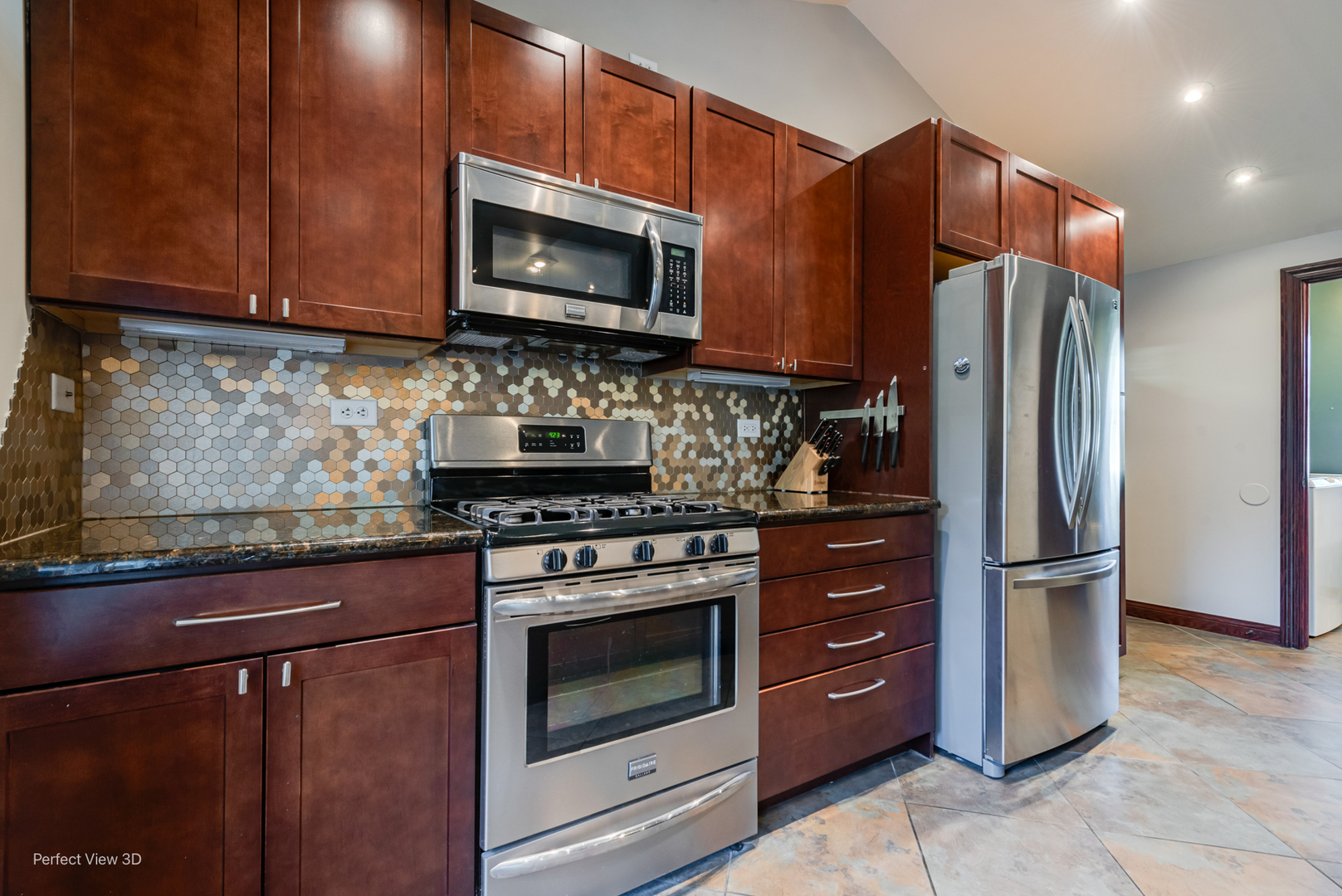 800 Charles Street Morris, IL 60450 - Photo 11 of 24 a kitchen with stainless steel appliances granite countertop a refrigerator stove and microwave