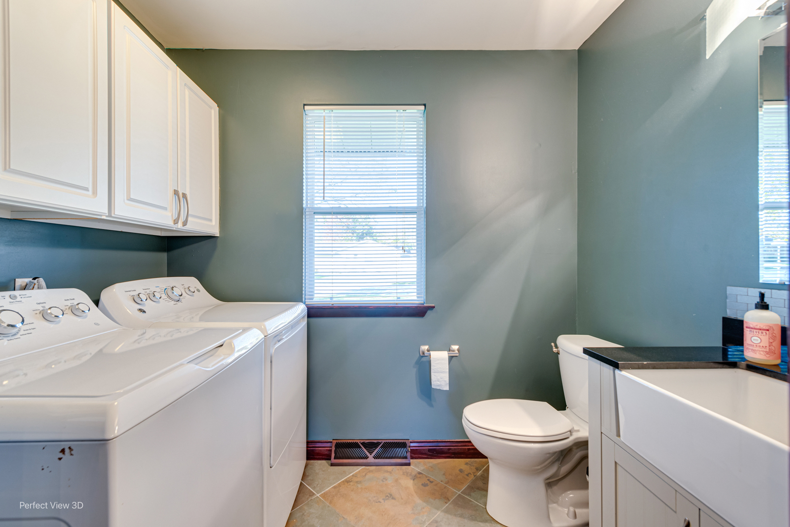 800 Charles Street Morris, IL 60450 - Photo 13 of 24 a white toilet sitting next to a bathroom sink