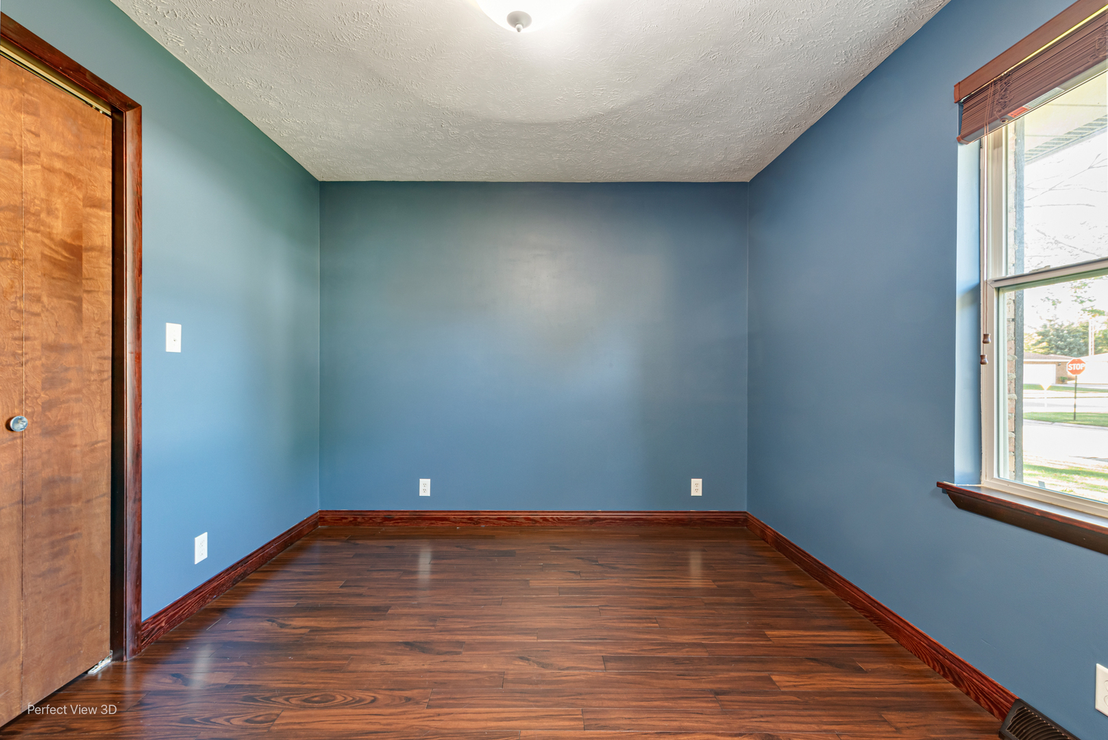 800 Charles Street Morris, IL 60450 - Photo 16 of 24 a view of room with window and wooden floor