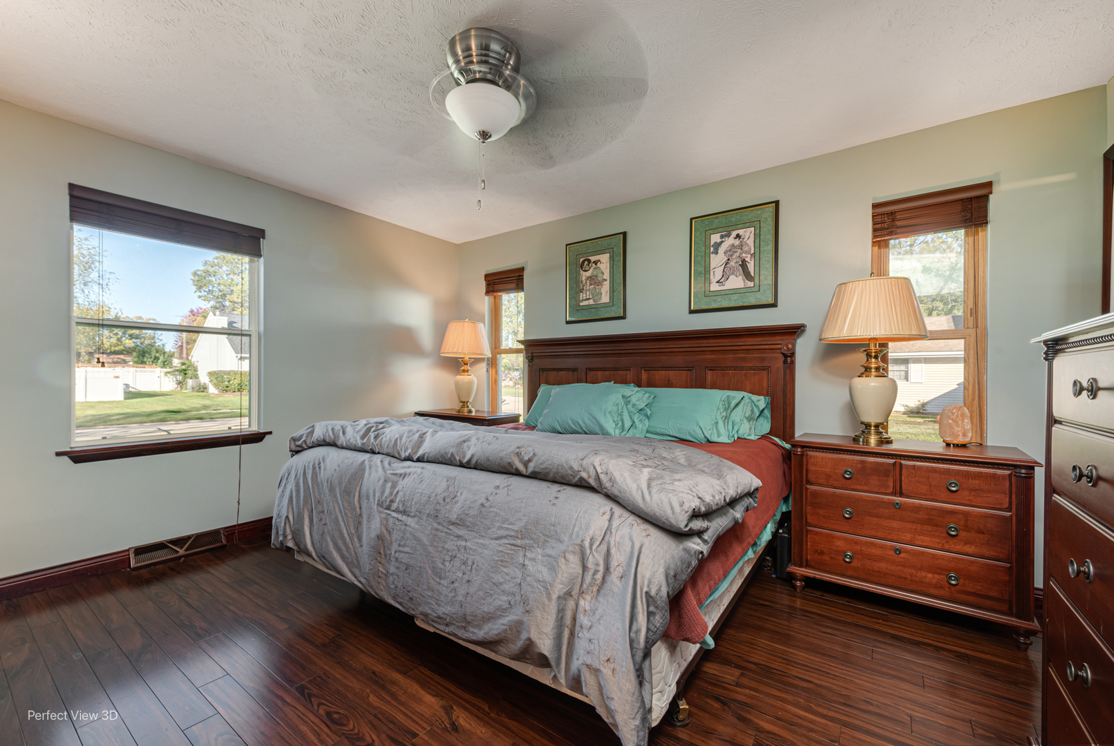 800 Charles Street Morris, IL 60450 - Photo 18 of 24 a bedroom with a bed and wooden floor