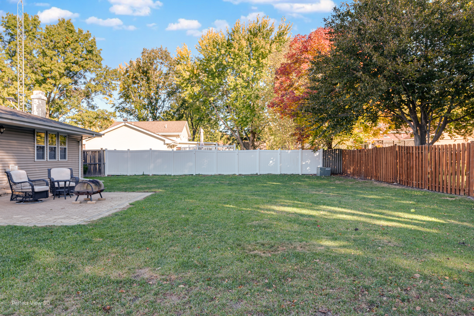 800 Charles Street Morris, IL 60450 - Photo 4 of 24 a view of a backyard with table and chairs and wooden fence