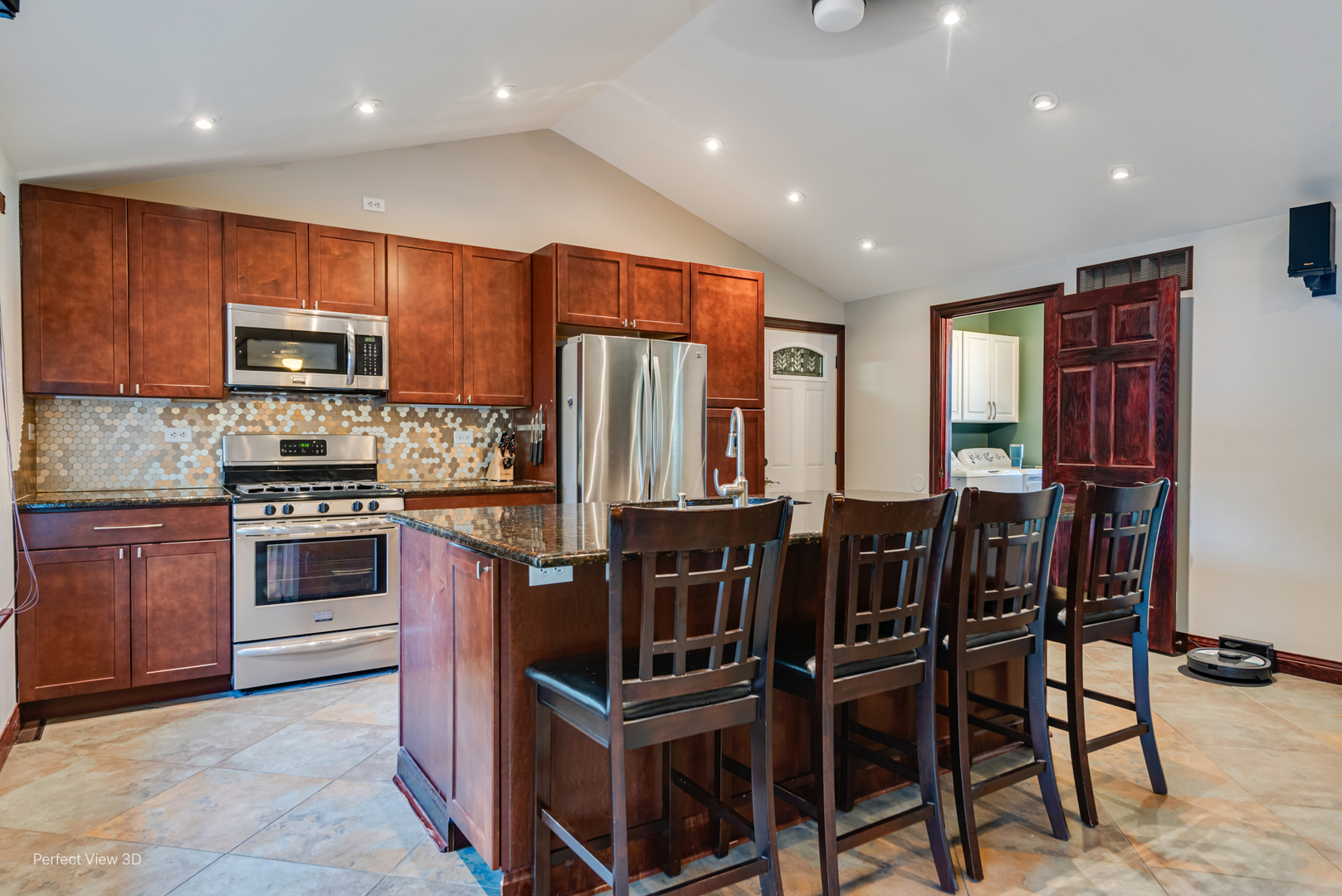 800 Charles Street Morris, IL 60450 - Photo 9 of 24 a kitchen with stainless steel appliances granite countertop a stove and a refrigerator