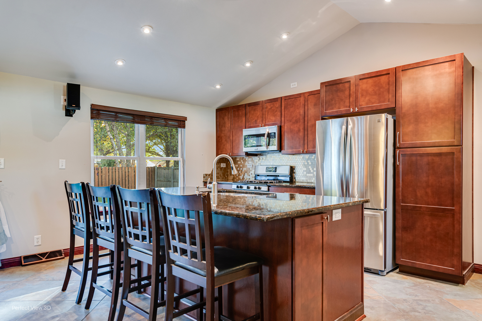 800 Charles Street Morris, IL 60450 - Photo 10 of 24 a kitchen with stainless steel appliances a table chairs refrigerator and a sink