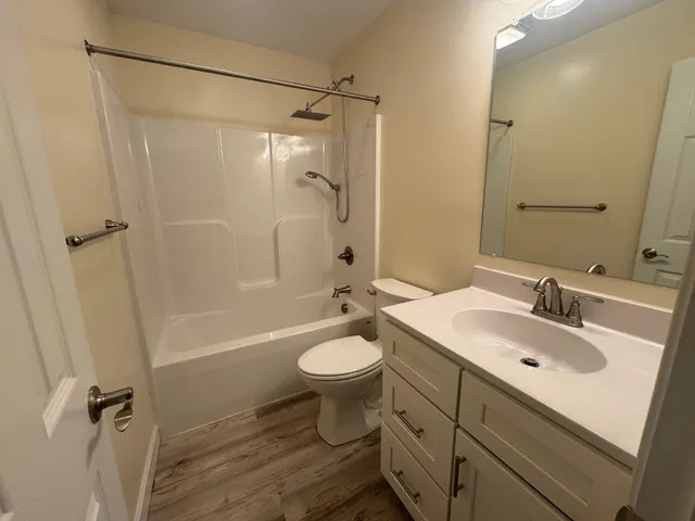 a view of a house with a yard and garage