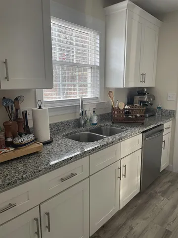 a view of balcony with wooden floor