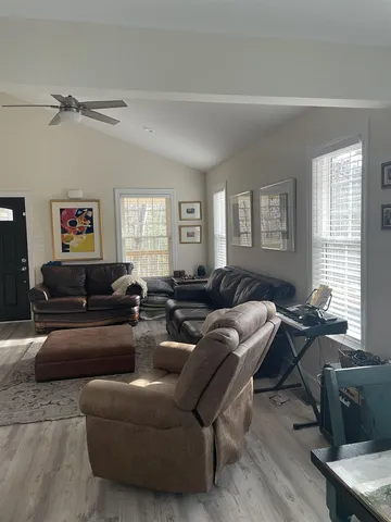 a living room with furniture and a window