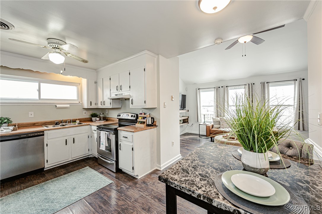 3711 Yard Arm Drive Chester, VA 23831 - Photo 20 of 50 a kitchen with stainless steel appliances granite countertop a stove a sink and a refrigerator