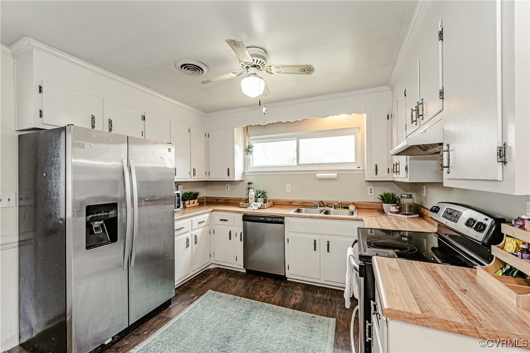 3711 Yard Arm Drive Chester, VA 23831 - Photo 22 of 50 a kitchen with a sink a stove cabinets and stainless steel appliances