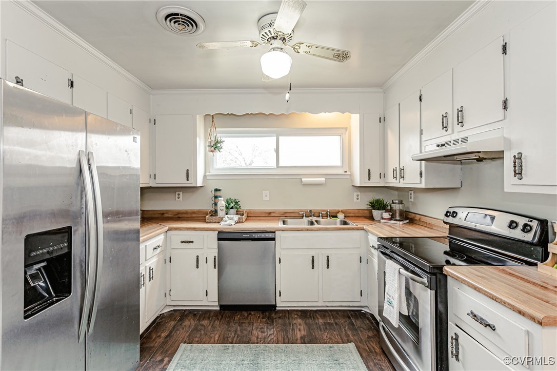 3711 Yard Arm Drive Chester, VA 23831 - Photo 23 of 50 a kitchen with cabinets stainless steel appliances a sink and a window