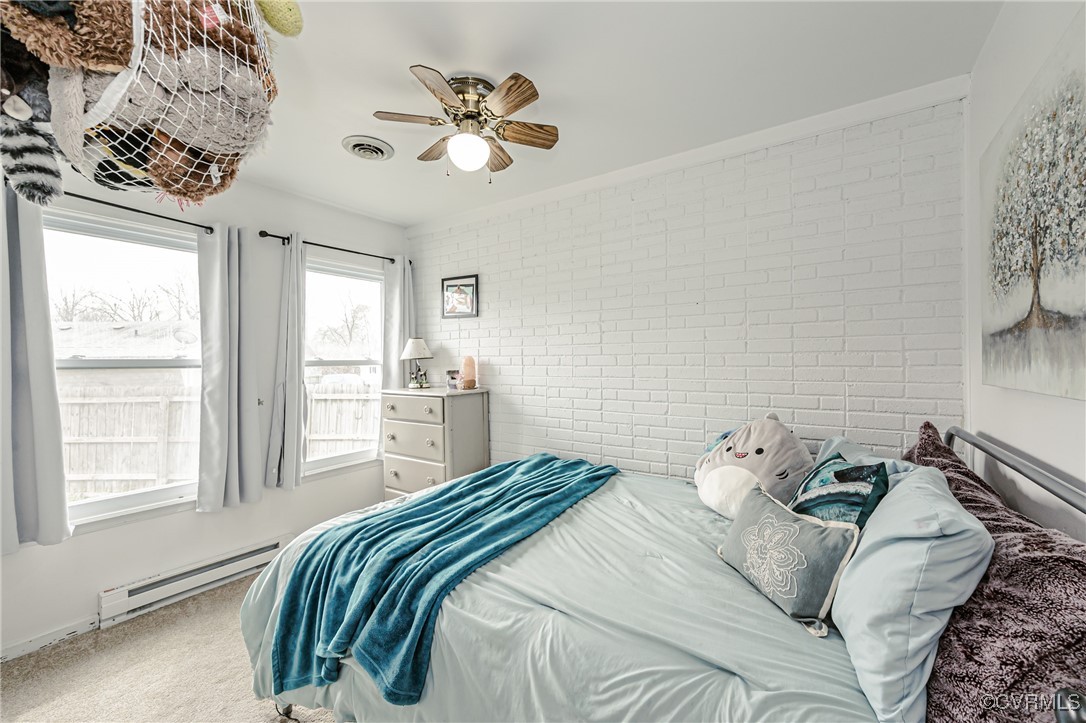 3711 Yard Arm Drive Chester, VA 23831 - Photo 31 of 50 a bedroom with a bed and a chandelier