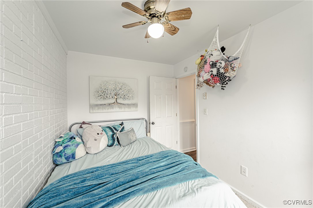 3711 Yard Arm Drive Chester, VA 23831 - Photo 32 of 50 a bedroom with a bed and a chandelier