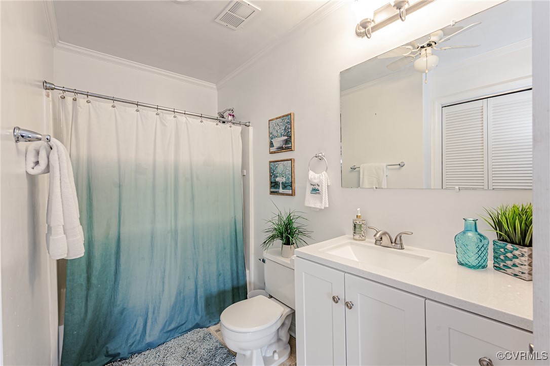 3711 Yard Arm Drive Chester, VA 23831 - Photo 40 of 50 a bathroom with a sink a large mirror and a toilet