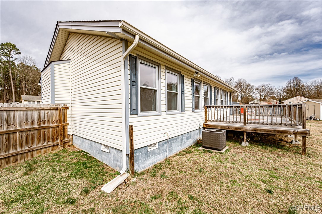 3711 Yard Arm Drive Chester, VA 23831 - Photo 49 of 50 a view of a house with wooden deck and furniture