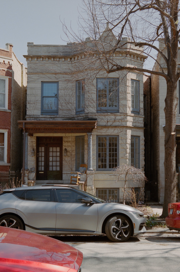 a front view of a house with parking space