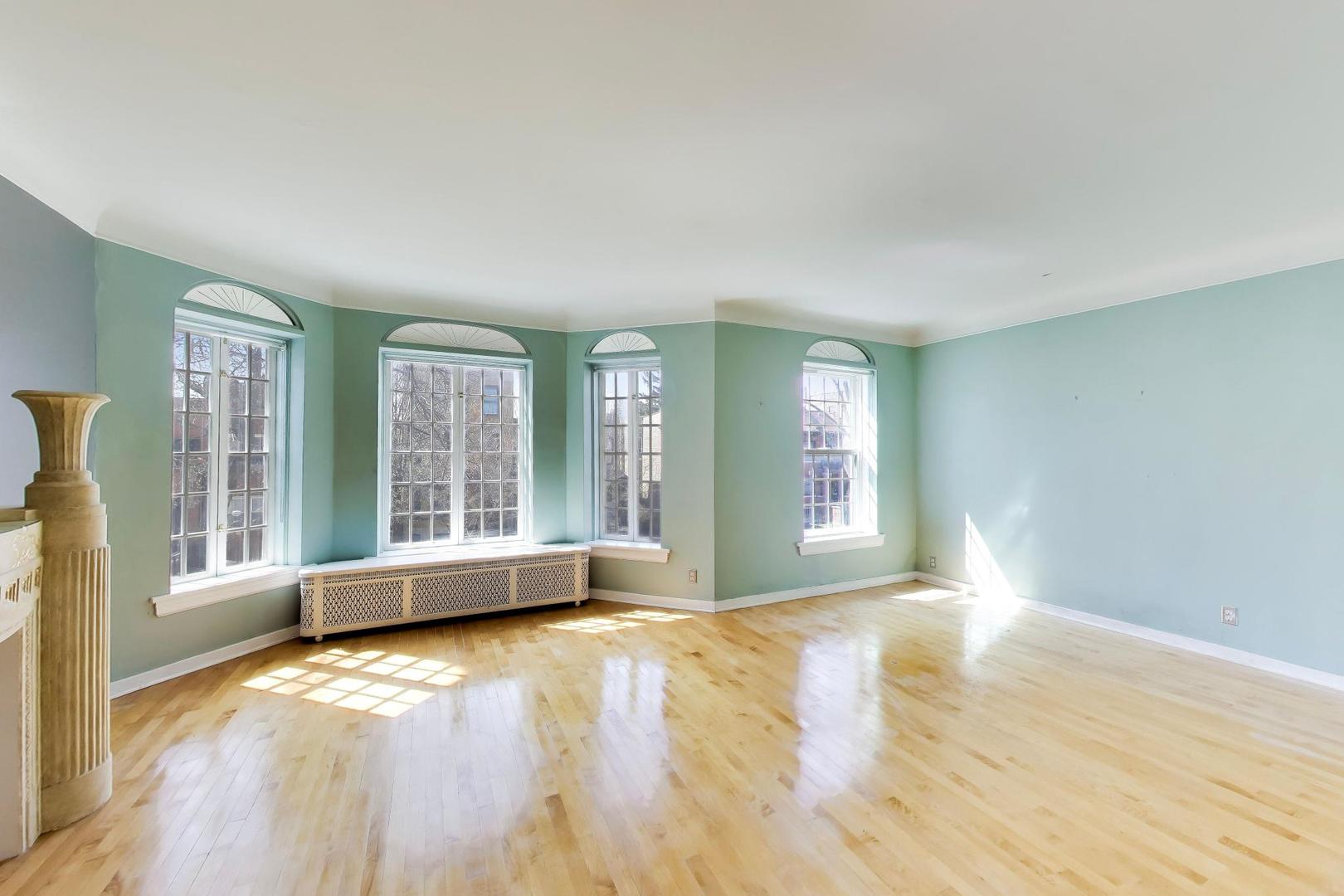 2629 North Troy Street Chicago, IL 60647 - Photo 4 of 16 a view of an empty room with wooden floor and a window