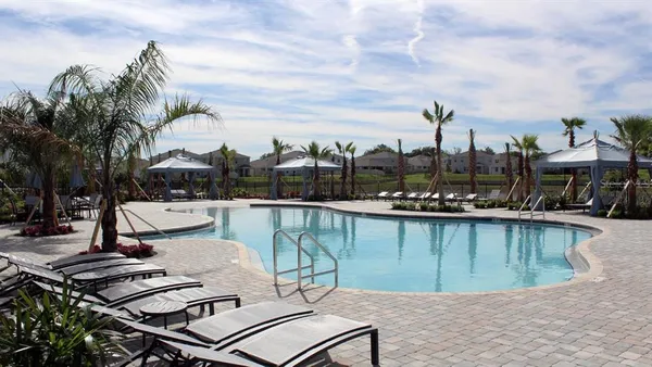 a view of a swimming pool with a lounge chairs