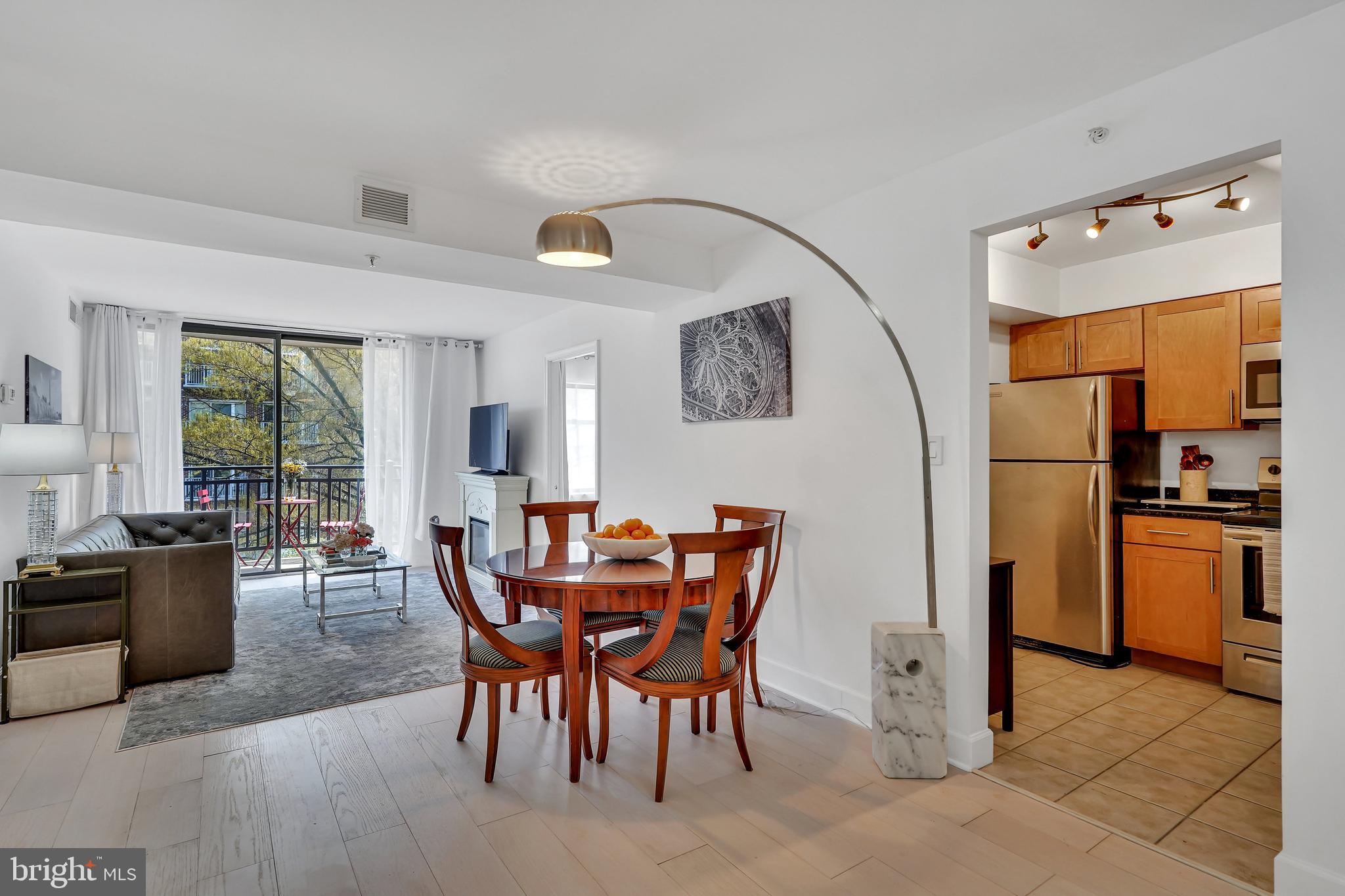 a dining room with furniture and window