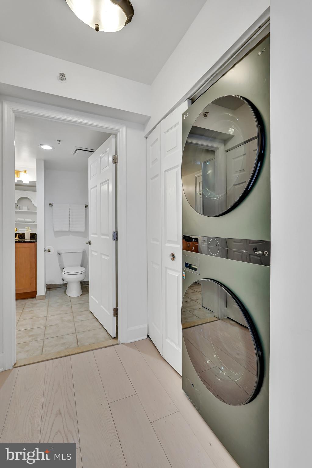 3401 38th Street Northwest, Unit 407 Washington, DC 20016 - Photo 11 of 28 a bathroom with a toilet and a mirror